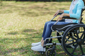 Obraz premium Depressed sad asian woman in wheelchair&nbsp;lonely disabled adult