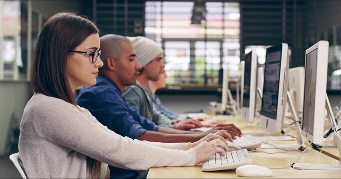 Computer, student and woman typing in university, learning or research online in class. Desktop, college and female person web browsing for knowledge, education and focus on studying with side view.