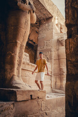Fototapeta na wymiar young male traveler visits Karnak temple in Luxor, Egypt