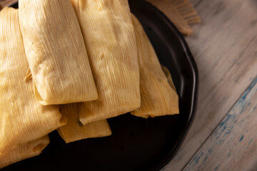 Tamales. Prehispanic dish typical of Mexico and some Latin American countries. Corn dough wrapped in corn leaves. The tamales are steamed.
