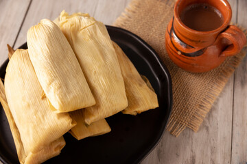 Tamales. Prehispanic dish typical of Mexico and some Latin American countries. Corn dough wrapped in corn leaves. The tamales are steamed.