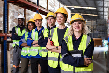 Group of smiling worker standing together at logistic distribution warehouse, Teamwork concept