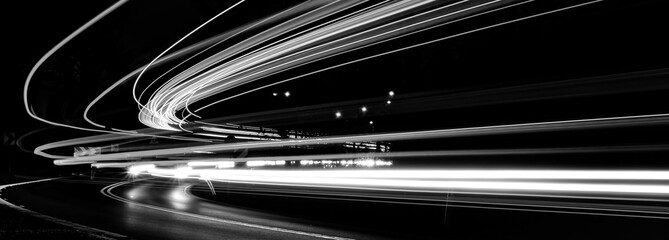 white lines of car lights on black background
