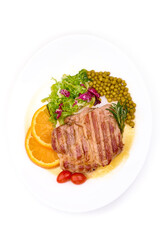 Grilled beef steak with potato wedges, grilled pears, isolated on white background.