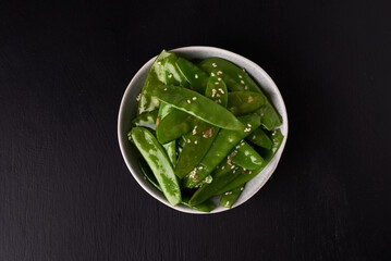 fried sugar snap peas in asian style top view
