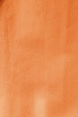 vertical orange crumpled paper surface texture close up