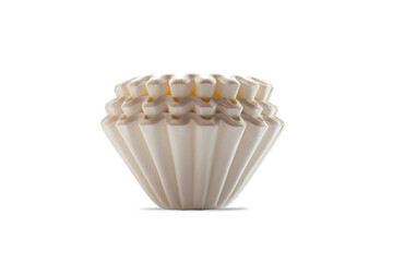 Side view closeup stack of new unbleached basket-type disposable paper coffee filters isolated on...