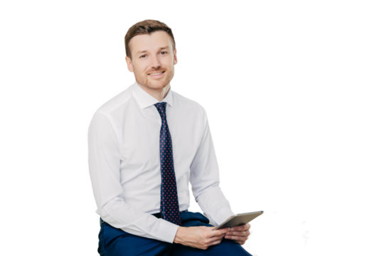 Indoor shot of male financier with positive expression wears formal white shirt with tie, holds modern tablet computer in hands, isolated over white background. People, work and technology concept