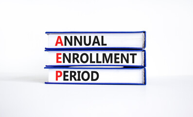 AEP symbol. Concept words AEP Annual enrollment period on beautiful books. Beautiful white table...