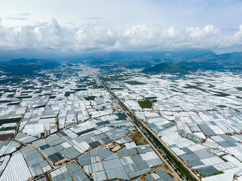 A drone-captured snapshot of Kumluca, Antalya's extensive greenhouse structures. - Powered by Adobe
