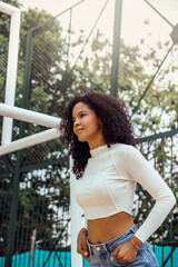 beautiful woman with dark and curly skin