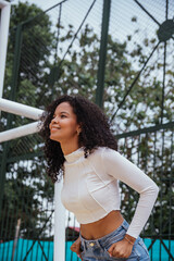 beautiful woman with dark and curly skin