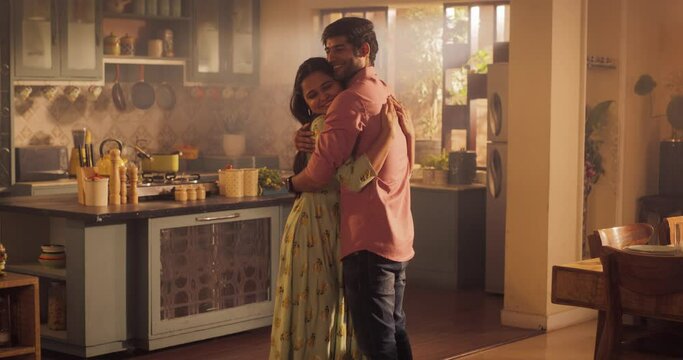 A Heartwarming Moment of Reunion: Young Couple Meet at Home and Greet Each Other with Warmth and Affection after Long Parting. Embracing Each Other Tightly, Sharing a Moment of Love and Connection