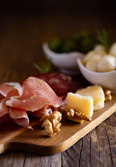 typical Italian antipasto platter with cold cuts and cheeses