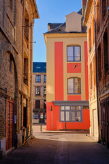 Fototapeta na wymiar Historic side-streets of Dieppe. Bright colours in high contrast.