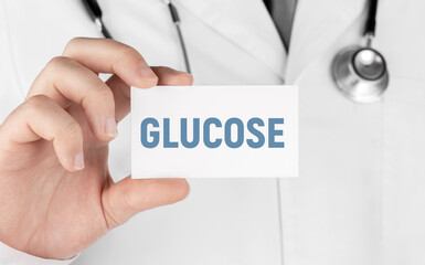 Doctor holding a card with text Glucose, Medical concept