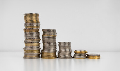 Stacks of coins on a white background