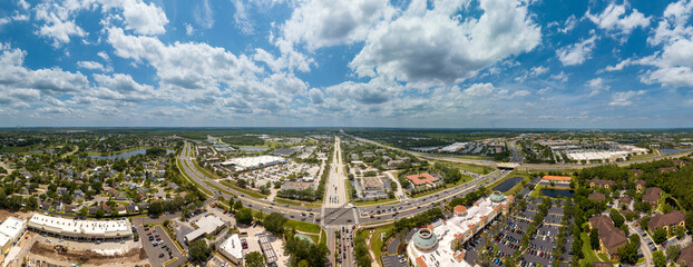 Aerial wide panoramic view of east Orlando (Waterford Lakes), Florida. USA with downtown Orlando city in the distant skyline. May 5, 2023.