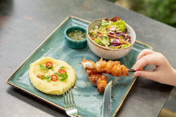 Mashed potatoes, chicken kebab, salad. Children's menu in the restaurant.