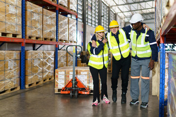 Male warehouse worker have an accident during working in the storage warehouse and his friends come to help or assist him and taking him to the safety area.