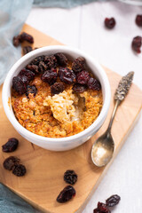 Baked Oatmeal with Dried Fruits like Sultanas, Raisins and Grapes, single portion meal made from oats