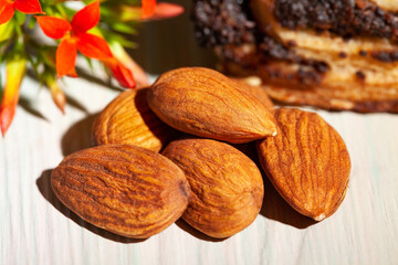 almond heap on wood background