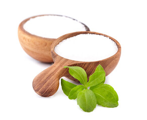 Stevia rebaudiana, sweet leaf sugar substitute isolated in wooden spoon on white background