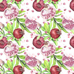 Watercolor illustration of a seamless pattern of ripe pomegranates and green branches with leaves isolated on a transparent background. Application is intended for printing on textiles, packaging