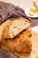 Rustic Perfection: Artisanal Italian Bread With Butter, Baked to Crusty Golden-Brown Perfection, a Staple of Italian Cuisine for Sandwiches, Bruschetta