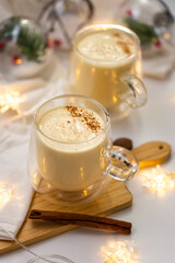 Creamy Delight: Indulge in Festive Eggnog, a Rich and Spiced Holiday Drink, Brimming with Cream, Eggs, and Winter Flavors for a Classic and Decadent Seasonal Treat