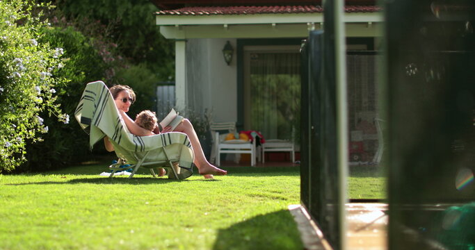 Swimming Pool Atmosphere During Summer Day, Family Enjoying Pool Backyard Home Vacations, Child Getting Out Of Pool