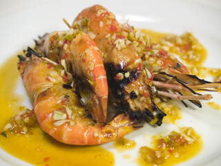 Spicy grill prawns over hot charcoal with chilli and garlic sauce