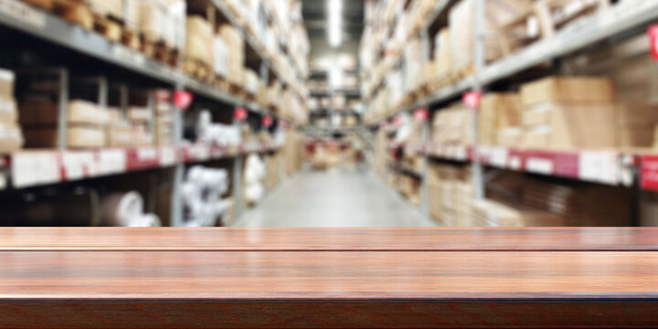 Empty Wooden Table, Blur Storage Warehouse Shelves Background. .