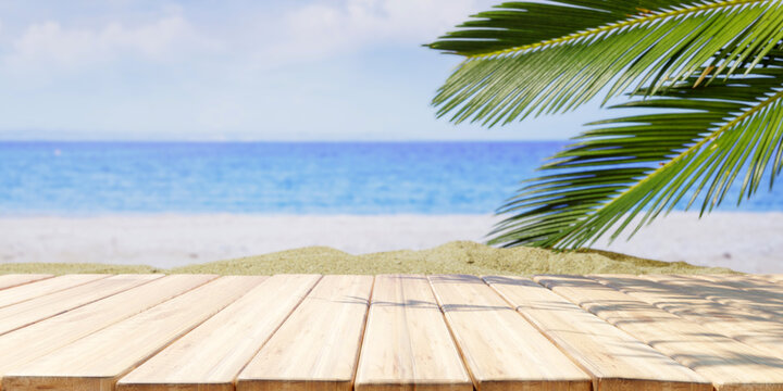 Empty wooden table outdoors, green park nature background, product display template