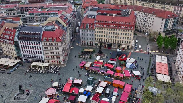 Drone shot of People on Market Place ( The Neumarkt ) on a Sunny Spring Day in Dresden , it is a central and culturally significant section of central Dresden, Germany . Busy Market Square .