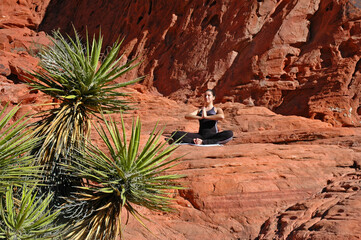 Doing yoga on red rocks