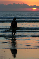 Surfer at sunset, Kuta beach, Bali