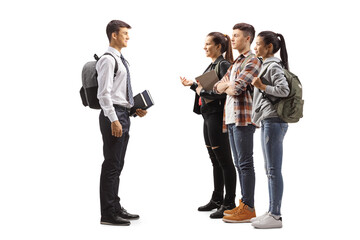 Full length profile shot of a male student having a conversation with a group of friends