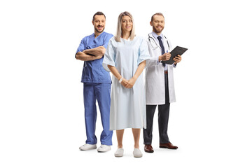 Female patient in a hospital gown standing in front of doctors