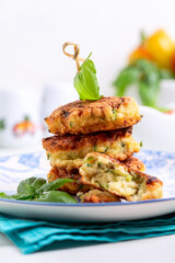 Zucchini fritters or zucchini pancakes. Vegetarian food.