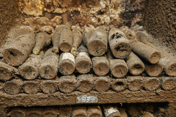 Dusty old wine bottles in the wine cellar of a winery 