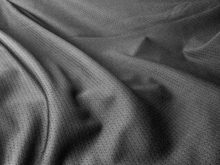 Wrinkled black polyester fabric close up