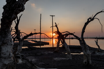 Sunset with remains of city that was submerged under salt water, not people