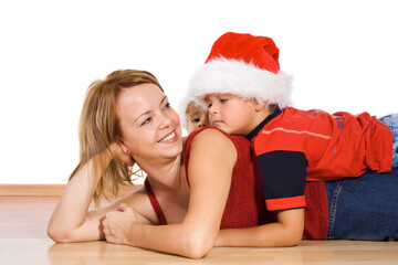 Woman and kids with santa hats at christmas time - isolated