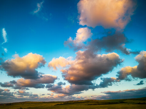 Big white fluffy clouds in the blue sky.Summer background. - Image	
