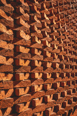 A study in texture symmetry: red bricks in angles under warm sunlight