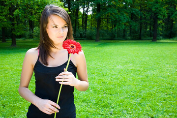 Woman With Flower In The Park