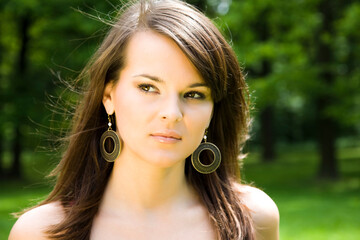 Naklejka premium Young Glamour Model Relaxing Outdoors