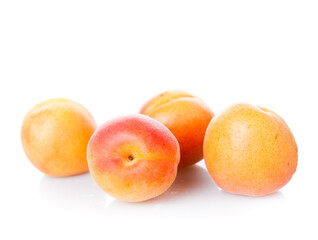 group of apricots over white