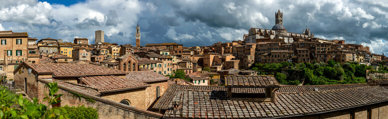 Scenery of Siena, a beautiful medieval town in Tuscany, with view of the Dome & Bell Tower of Siena Cathedral (Duomo di Siena), landmark Mangia Tower and Basilica of San Domenico,Italy - obrazy, fototapety, plakaty